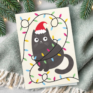 Tarjeta Festiva Gato lindo con sombrero de Santa y luces de Navida