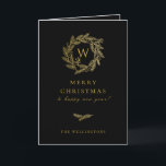 Tarjeta Festiva Golden Winter Wreath Black<br><div class="desc">Elegante monograma de invierno dorado,  tarjeta de saludo de vacaciones en negro clásico. Características de la tarjeta que coinciden con el patrón dentro y con varias líneas de plantilla para el saludo de su personalizado.</div>