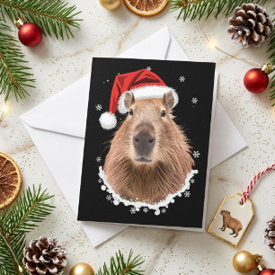 Tarjeta Festiva Gorra divertida de Santa Capibara Navideña nevada