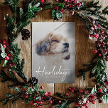 Tarjeta Festiva Happiest Howlidays | Dog Photo Christmas Minimal<br><div class="desc">Simple, stylish custom photo Happiest Howlidays flat holiday greeting card with modern minimalist handwritten script typography in white and a simple gradient over a full photo with a natural taupe gray color on the reverse. The photo of your beloved pet and text can easily be personalized for a design as...</div>