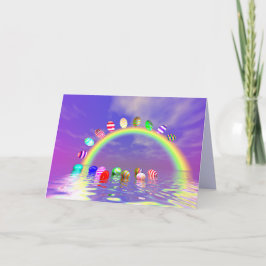 Tarjeta Festiva Huevos de Pascua en un arcoiris