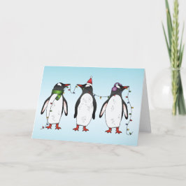 Tarjeta Festiva Ilustración de tres pingüinos navideños festivos