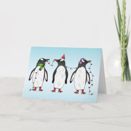 Tarjeta Festiva Ilustración de tres pingüinos navideños festivos