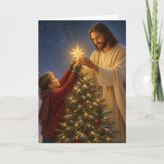 Tarjeta Festiva Jesús Ayuda a un Niño a Decorar el Árbol de Navida