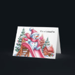 Tarjeta Festiva Jugativo hombre de nieve en el área de juegos rosa<br><div class="desc">Revela en el espíritu festivo con este encantador cuadro de un muñeco de nieve de plumón adornado con accesorios rosas,  deslizándose alegremente por un vibrante tobogán rosa entre un parque infantil rodeado de árboles navideños y una manta de nieve.</div>