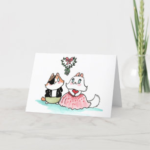 Tarjeta Festiva Kit y Angora bajo el mistletoe