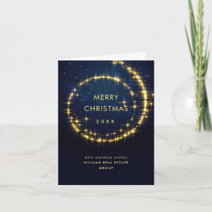 Tarjeta Festiva La aguja de la marina de oro ilumina a Navidades c