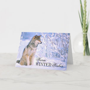 Tarjeta Festiva Lobo de madera sentado en la nieve