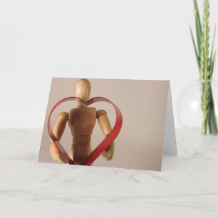 Tarjeta Festiva Maniquí que lleva a cabo el corazón
