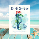 Tarjeta Festiva Mares y saludos Navidades náuticos<br><div class="desc">Celebra la temporada con el encanto de la costa —este caballito de mar de acuarela, con un sombrero de Santa, aparece contra un fondo abstracto de salpicaduras oceánicas con la breve leyenda "Mares y saludos". Perfecto para los amantes de la playa, esta carta ofrece alegría salada-dulce desde el mar. ⛱️...</div>