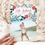 Tarjeta Festiva Mele Kalikimaka | Hawaiian Christmas Photo<br><div class="desc">Send holiday greetings to friends and family, island-style, with our tropical holiday photo cards. Design features your favorite photo with the Hawaiian Christmas greeting "Mele Kalikimaka" in red hand lettered typography, flanked by vibrant red poinsettia flowers and holly leaves that cascade over your photo. Personalize with your names and the...</div>