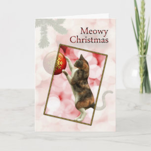 Tarjeta Festiva Meowy Navidades con un gato juguetón.