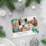 Tarjeta Festiva Mistletoe Twigs Collage de fotos Felices Fiestas<br><div class="desc">Tarjeta de Navidades fotográficos con un collage con cuatro fotos y ramas de bonito mistletoe en verde y azul pálido. Felices fiestas están escritas en un guion azul marino, encantador. Añada el nombre de su familia y el año en elegantes fuentes azules. La parte posterior presenta un patrón mistletoe en...</div>