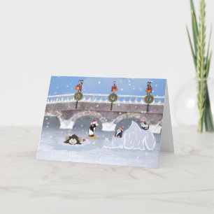 Tarjeta Festiva Navidad, pingüinos juguetones en el lago congelado
