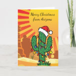 Tarjeta Festiva Navidades de Arizona Saguaro Cactus<br><div class="desc">Pequeño cactus de Saguaro en el desierto vistiendo un gorra Navidad y luces Navidades</div>