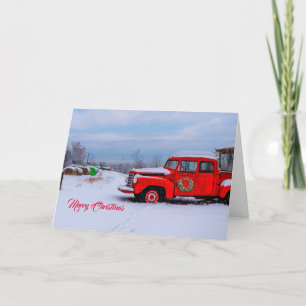 Tarjeta Festiva Navidades de campo nevados con camión rojo