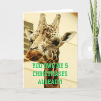 Tarjeta Festiva Navidades de jirafas furiosos recuerdan deuda mone