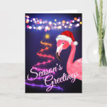 Tarjeta Festiva Navidades de playa tropical Flamingo Rosado<br><div class="desc">La tarjeta de bienvenida de los Navidades tropicales de playa Greetings de esta temporada incluye un flamingo rosa con un sombrero de Santa blanca y roja. Hay luces de cuerda festivas y un árbol de Navidad de Cinta y Estrellas. Saludo interno ~ "Los Deseos Más Cálidos De Nuestro Paraíso De...</div>