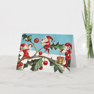 Tarjeta Festiva Navidades de Santa Elves pintando bayas en hojas