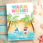 Tarjeta Festiva Navidades de Santa Mermaid Beach<br><div class="desc">La tarjeta de Navidades Tropical "Warm Wishes" incluye Santa y una sirena nadando en el océano al atardecer,  enmarcada por un par de palmeras adornadas con luces de cuerda. Santa está tomando un cóctel de una piña y parpadeando el signo holgado de los halcones hawaianos. Arte de KL Stock.</div>