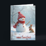 Tarjeta Festiva Navidades Snowman con conejito<br><div class="desc">Un muñeco de nieve con un gorra rojo y una bufanda se levanta alegremente al lado de un pequeño conejito,  también vestido cálidamente,  rodeado por un paisaje nevado con suave nevada. Se puede cambiar el texto.</div>