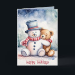 Tarjeta Festiva Navidades Snowman Y Teddy Bear<br><div class="desc">Oso de peluche marrón color agua en copos de nieve con muñeco de nieve. El texto es editable.</div>