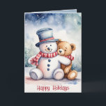 Tarjeta Festiva Navidades Snowman Y Teddy Bear<br><div class="desc">Oso de peluche marrón color agua en copos de nieve con muñeco de nieve. El texto es editable.</div>