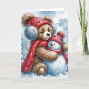 Tarjeta Festiva Navidades Teddy Bear abrazando a un hombre de niev