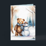 Tarjeta Festiva Navidades Teddy Bear Y Snowman<br><div class="desc">Oso de peluche marrón color agua en bosques de invierno con muñeco de nieve. El texto es editable.</div>