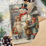 Tarjeta Festiva Nieve navideña vintage con niños en nieve<br><div class="desc">Celebre la magia de los Navidades con esta encantadora carta vintage que presenta a un hombre de nieve clásico rodeado de niños alegres. ¡Ideal para enviar cálidos deseos de vacaciones a la familia y amigos!</div>