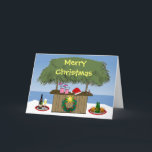 Tarjeta Festiva Ocean Beach Tropical Tiki Hut Bebe Navidades Diver<br><div class="desc">Este tema tropical lo tiene todo: bebidas mezcladoras, champán y cerveza en una bandeja, un sombrero de santa, una corona de vacaciones con una estrella, y el bar de la cabaña de tiki en la playa en la arena con el océano al fondo. Feliz Navidad está escrito en el techo...</div>
