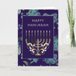 Tarjeta Festiva Oro azul Menorah flores Hanukkah saludo<br><div class="desc">Mano azul oscuro diseñado Feliz Chanuka tarjeta de saludo con un patrón de menorah y flor dorado azul.  Personalizar editando el saludo en la parte delantera de la tarjeta.y el mensaje en el interior de la tarjeta.</div>