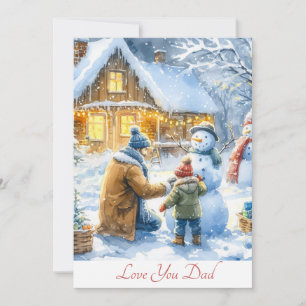 Tarjeta Festiva Padre e hijo lindos construyendo un muñeco de niev