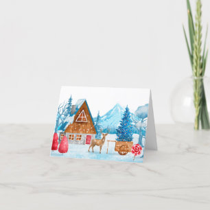 Tarjeta Festiva Paisaje invernal de una ciudad con un ciervo