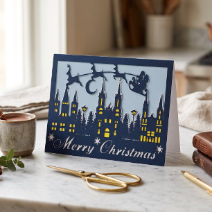 Tarjeta Festiva Papercut de Papá Noel Reno Paisaje Urbano en Navid