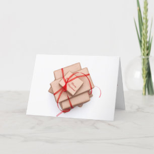 Tarjeta Festiva Paquetes del papel de Brown atados con la cinta