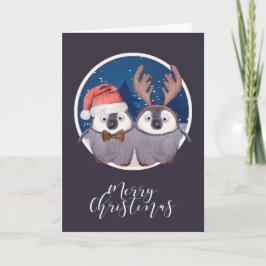 Tarjeta Festiva Pareja de pingüinos navideños lindos Santa y Reno