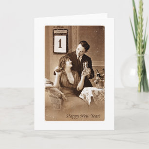 Tarjeta Festiva pareja que celebra el año nuevo con champagne,vint