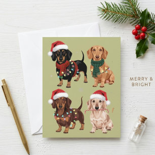 Tarjeta Festiva Perritos navideños adorables con sombreros y bufan