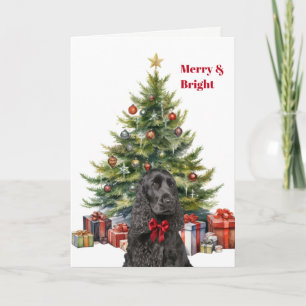 Tarjeta Festiva Perro Cocker Spaniel negro con lazo rojo en el árb