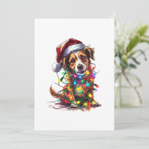 Tarjeta Festiva Perro juguetón en Sombrero Santa en luces Navidade