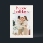 Tarjeta Festiva Personalizado Rojo Moderno foto Navidades felices<br><div class="desc">Difundir alegría de vacaciones con esta elegante tarjeta Happy Holidays, con texto rojo en negrita sobre un fondo crema cálido. Este diseño minimalista es a la vez elegante y atemporal, perfecto para enviar saludos de temporada con un toque moderno. Personalice el nombre de su familia para añadir un toque personal,...</div>
