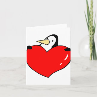 Tarjeta Festiva Pingüino que lleva a cabo diseño lindo del corazón