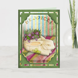 Tarjeta Festiva Plantador del conejito de pascua en ventana verde