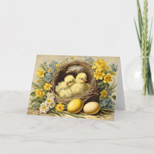 Tarjeta Festiva Pollitos de Pascua amarillos en una cesta y flores