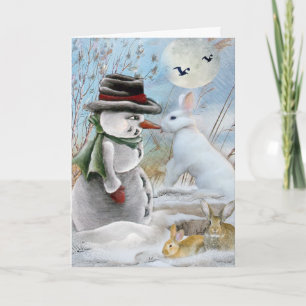 Tarjeta Festiva Rabbit comiendo la nariz de Snowman
