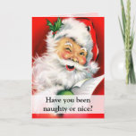 Tarjeta Festiva Saludo de guiño travieso o Niza de Santa<br><div class="desc">¿Usted ha sido travieso o agradable? La tarjeta doblada con Papá Noel feliz está guiñando un ojo mientras que lleva a cabo su lista de niños traviesos y agradables, o una lista de regalo para los días de fiesta. El retrato del vintage de Santa es diversión y alegre con su...</div>