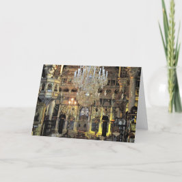 Tarjeta Festiva Saludos navideños al interior de una iglesia ortod