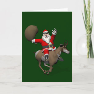 Tarjeta Festiva Santa Claus montando un Pronghorn
