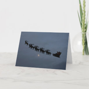 Tarjeta Festiva Santa y Silhouette de renos